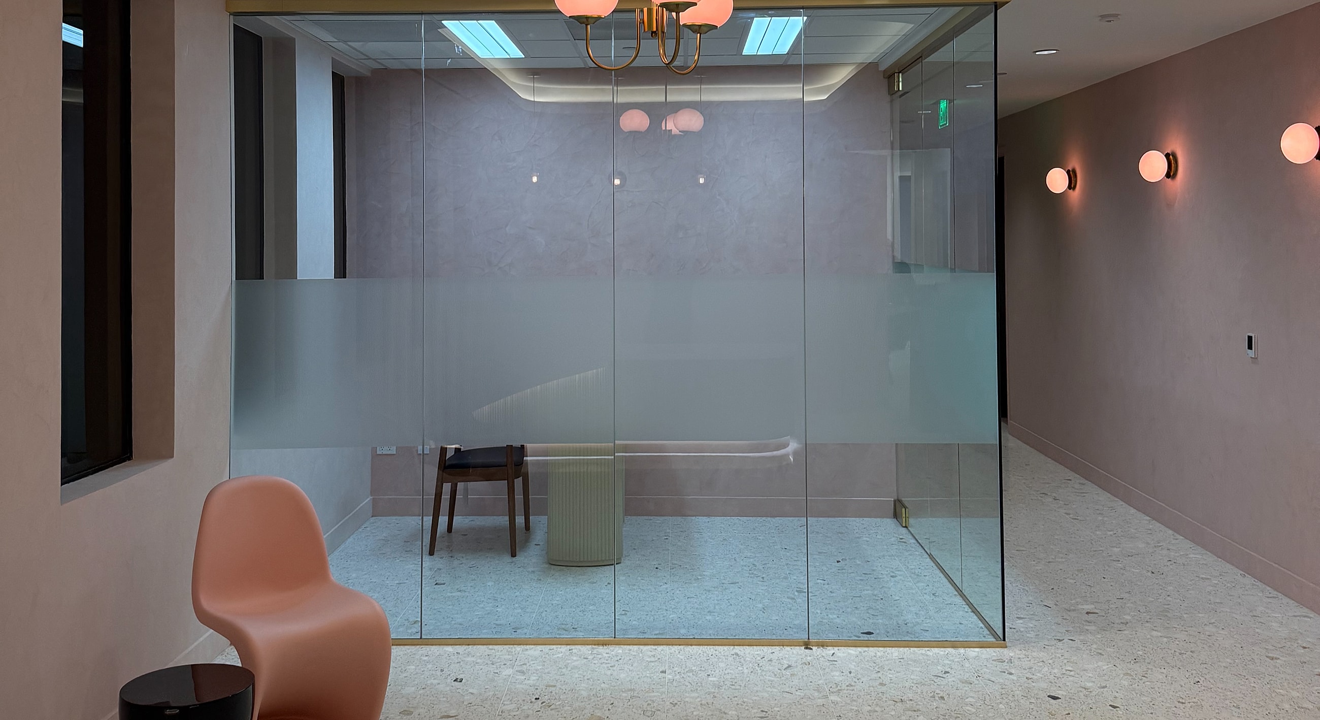 Modern office interior with glass meeting room.